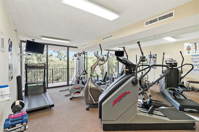 workout area with a textured ceiling