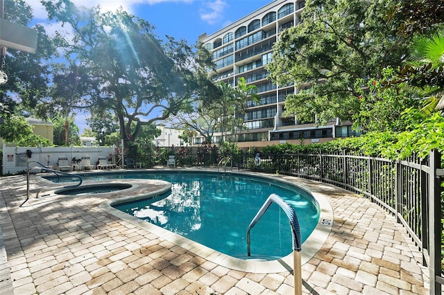 view of swimming pool with a patio area