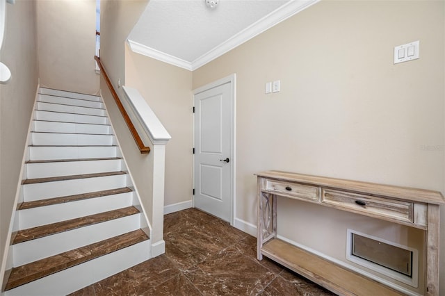 stairway featuring crown molding