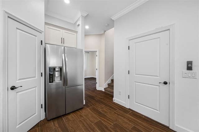 kitchen with ornamental molding, white cabinetry, stainless steel fridge with ice dispenser, and dark hardwood / wood-style floors