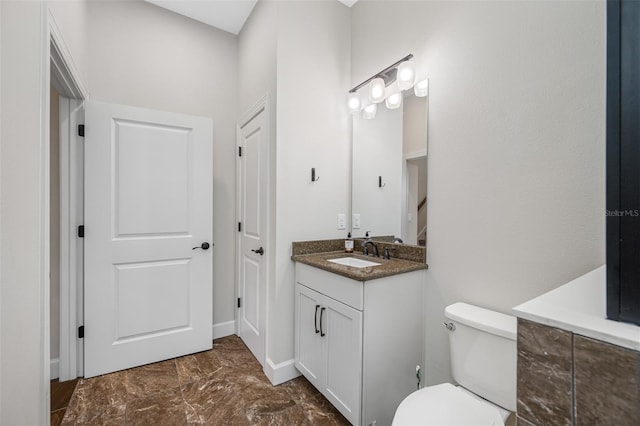 bathroom with toilet and vanity