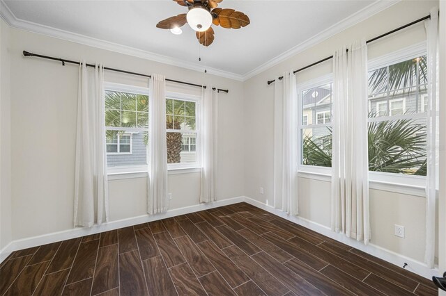 empty room with ceiling fan, dark hardwood / wood-style floors, and ornamental molding