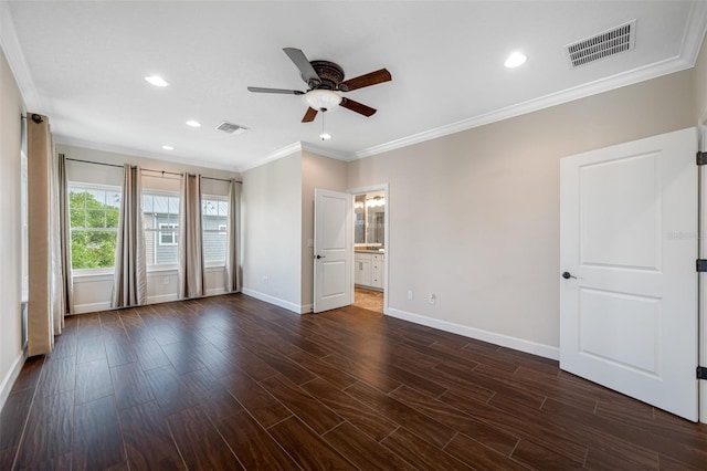 interior space featuring ensuite bathroom, dark hardwood / wood-style flooring, ceiling fan, and crown molding