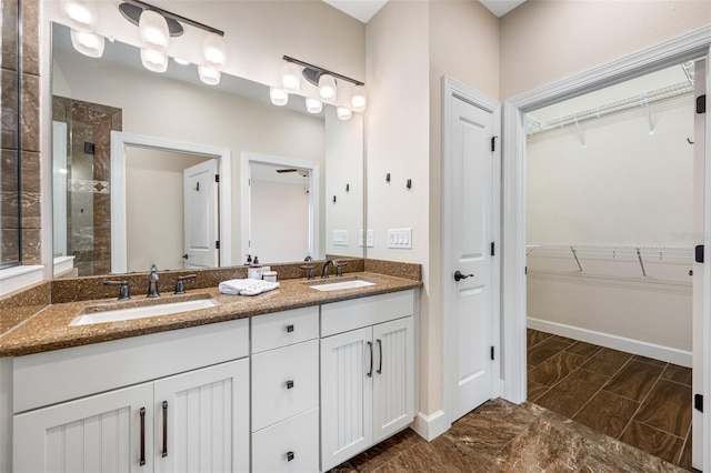 bathroom featuring vanity and a tile shower