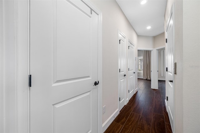 hallway featuring dark hardwood / wood-style flooring