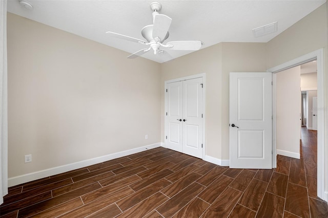 unfurnished bedroom with a closet and ceiling fan