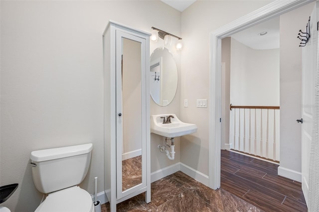 bathroom with sink and toilet