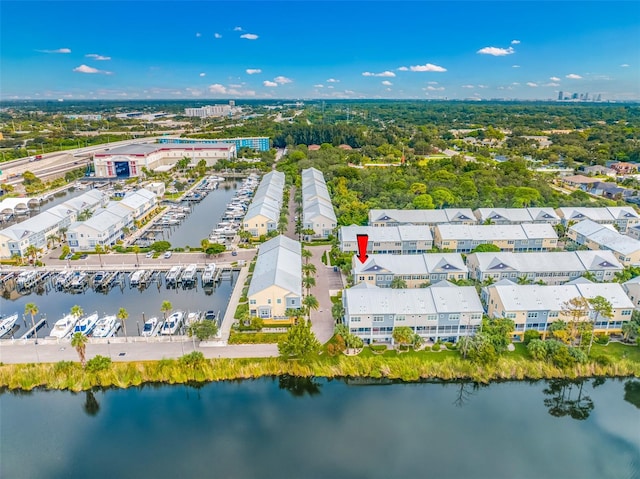 birds eye view of property featuring a water view