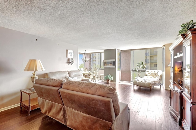 living room featuring a textured ceiling and hardwood / wood-style flooring