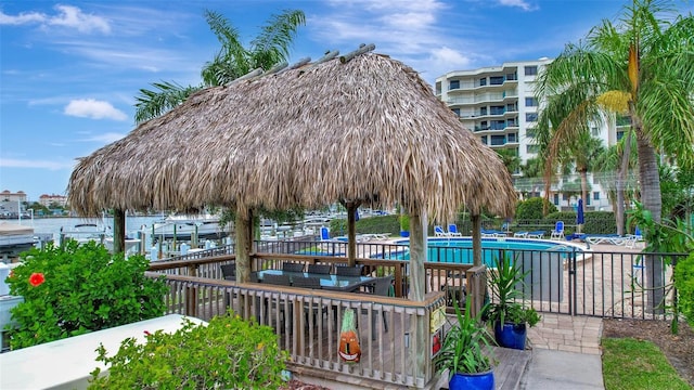 view of home's community featuring a water view and a swimming pool