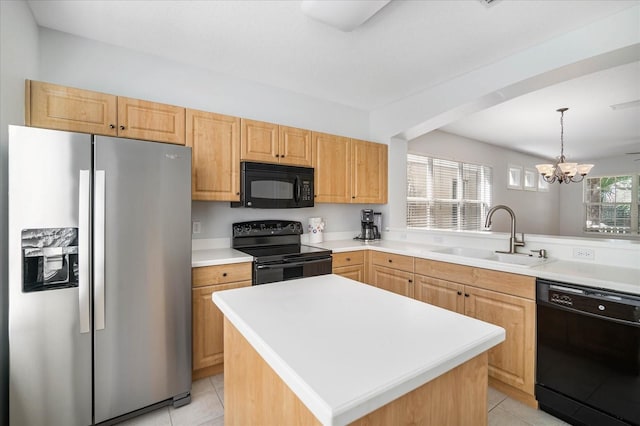 kitchen with a kitchen island, black appliances, a notable chandelier, sink, and light tile patterned flooring