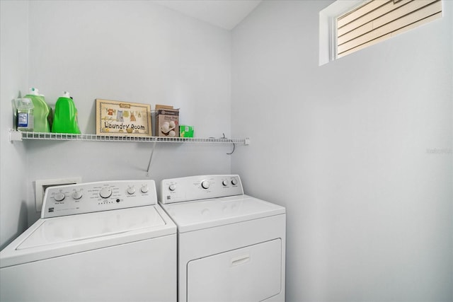 clothes washing area featuring washer and dryer