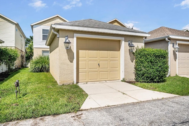 view of front facade featuring a garage and a front yard