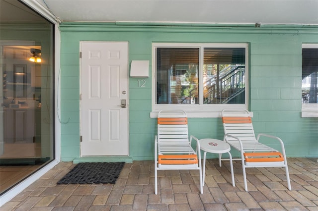 property entrance featuring concrete block siding