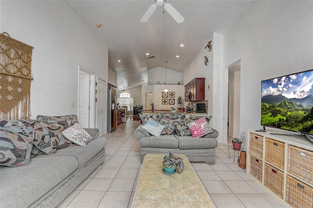 tiled living room featuring high vaulted ceiling and ceiling fan