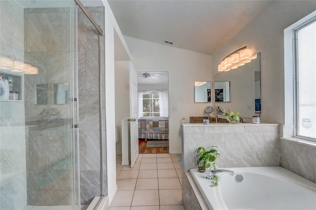 bathroom featuring tile patterned flooring, shower with separate bathtub, vaulted ceiling, and ceiling fan