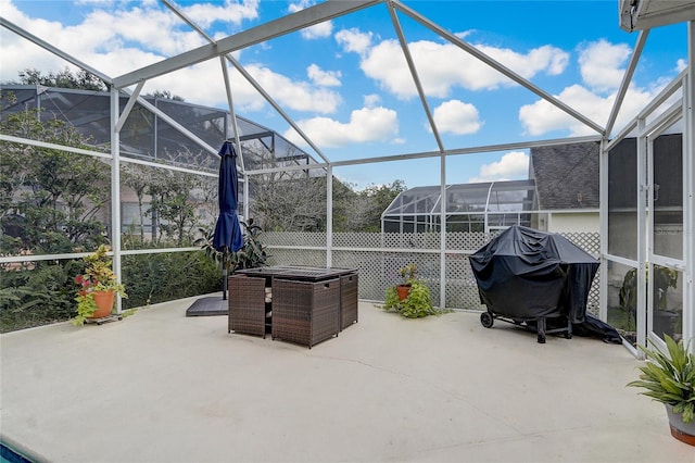 view of patio / terrace with grilling area and a lanai