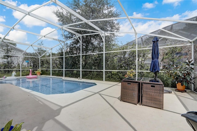 view of pool with a lanai and a patio area