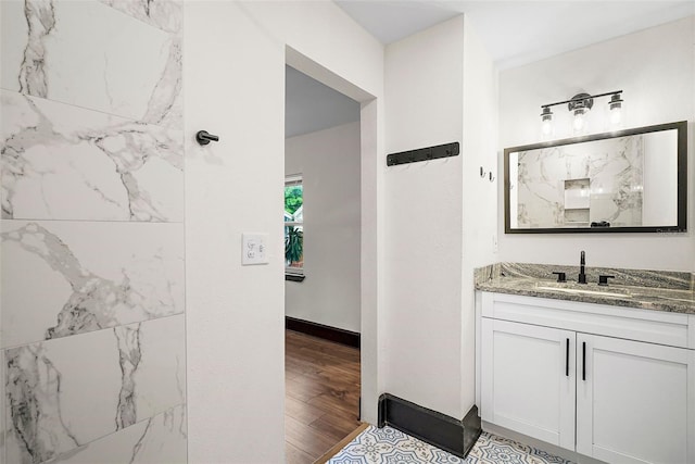 bathroom with vanity and wood-type flooring