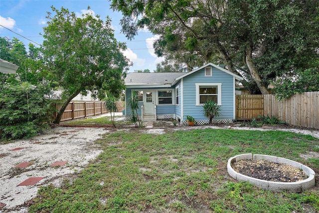 2111 Burlington Ave N, Saint Petersburg, FL 33713 - view of front of property featuring entry steps, a fenced backyard, and a front lawn