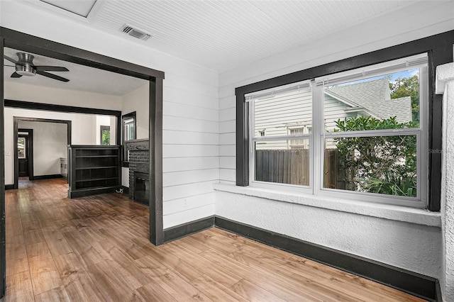 hallway featuring hardwood / wood-style flooring