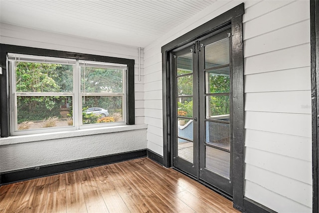 unfurnished sunroom featuring a healthy amount of sunlight