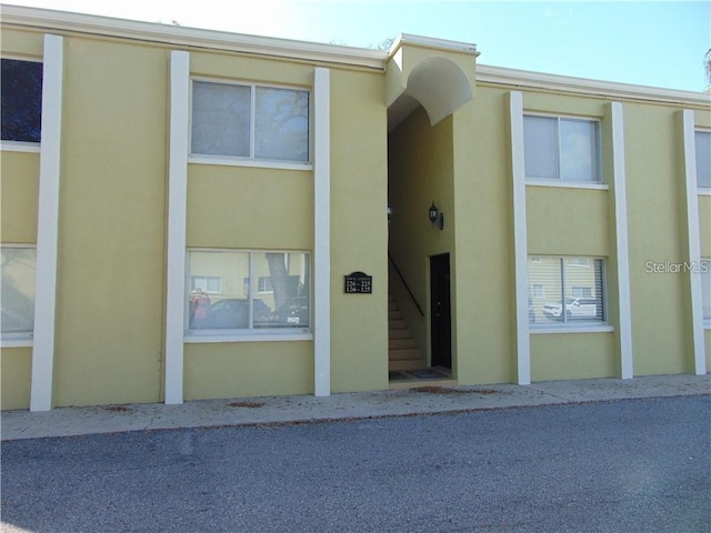 view of exterior entry with stucco siding