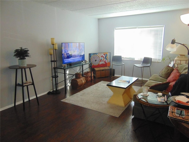 living room featuring wood finished floors and baseboards