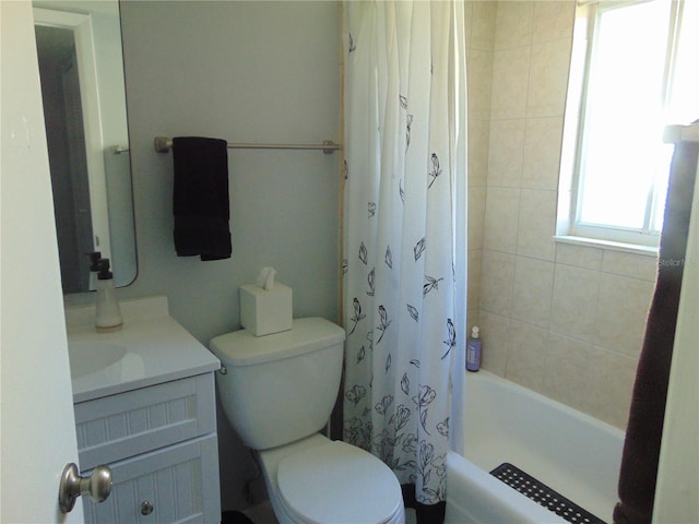 bathroom featuring shower / tub combo with curtain, vanity, and toilet