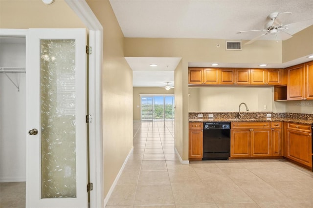 kitchen featuring ceiling fan, light tile patterned floors, black dishwasher, and sink