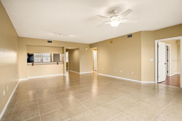 unfurnished room featuring ceiling fan