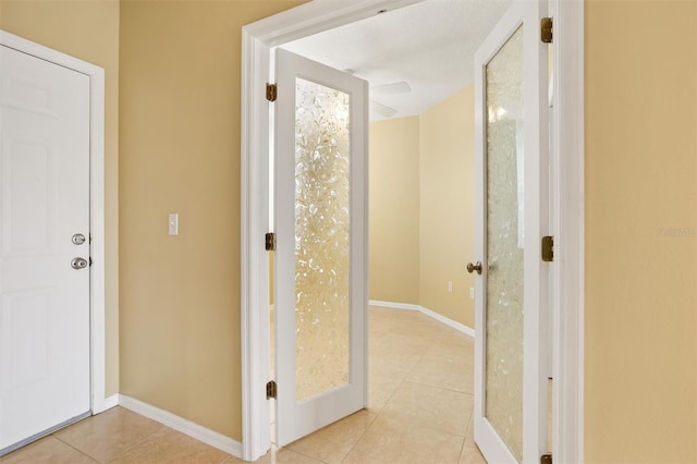 hallway featuring light tile patterned floors