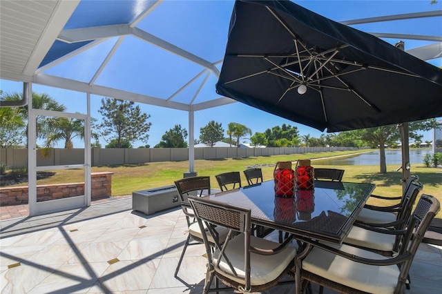 view of patio / terrace with a water view and glass enclosure