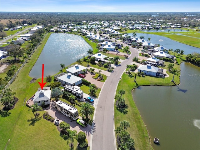 drone / aerial view with a water view