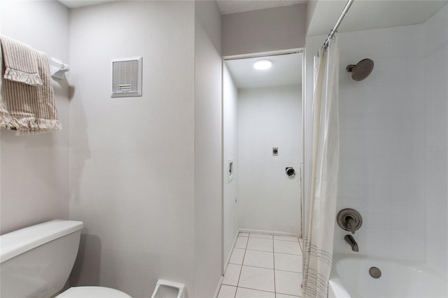 bathroom with toilet, tile patterned floors, and shower / bath combination with curtain