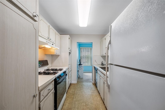 kitchen with white cabinetry and white appliances