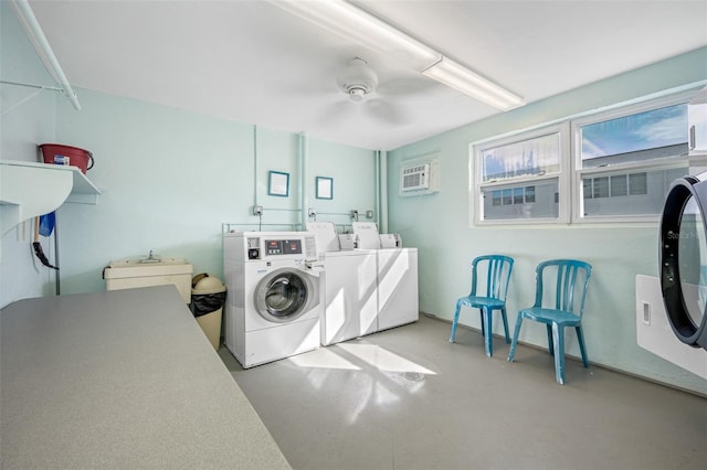 laundry room featuring washer and clothes dryer, ceiling fan, and an AC wall unit