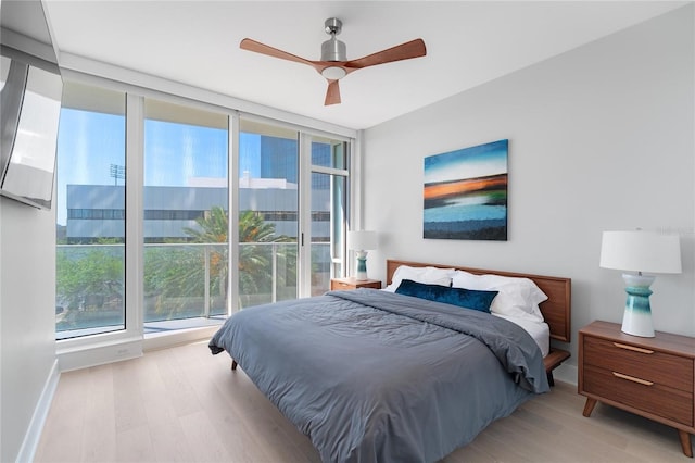 bedroom featuring ceiling fan and light hardwood / wood-style flooring