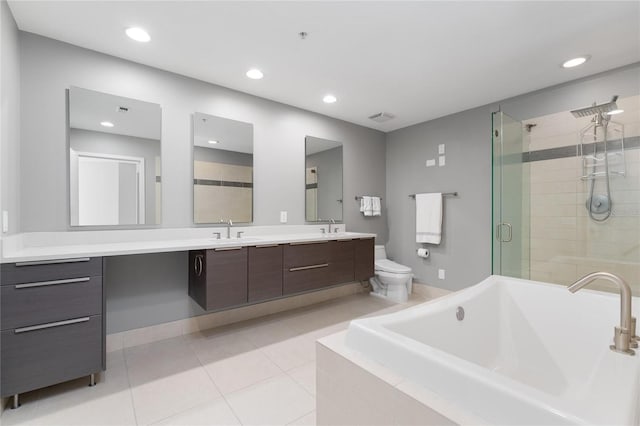 full bathroom with plus walk in shower, tile patterned flooring, toilet, and vanity