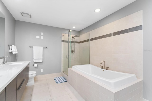 full bathroom featuring vanity, toilet, plus walk in shower, and tile patterned flooring