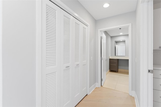 hallway with light wood-type flooring