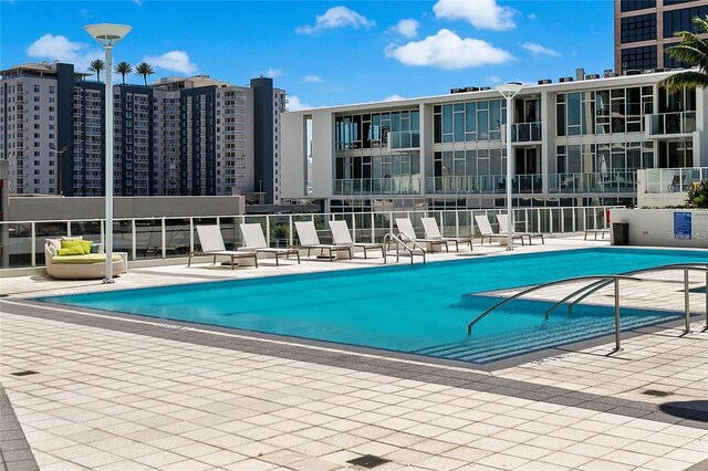 view of pool featuring a patio area