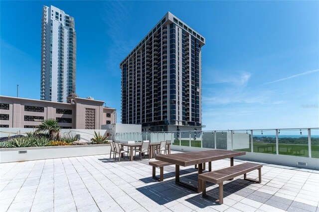 175 1st St S Unit 406, Saint Petersburg, FL 33701 - view of patio / terrace with outdoor dining area and fence