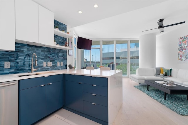 175 1st St S Unit 406, Saint Petersburg, FL 33701 - kitchen featuring stainless steel dishwasher, a peninsula, modern cabinets, and tasteful backsplash