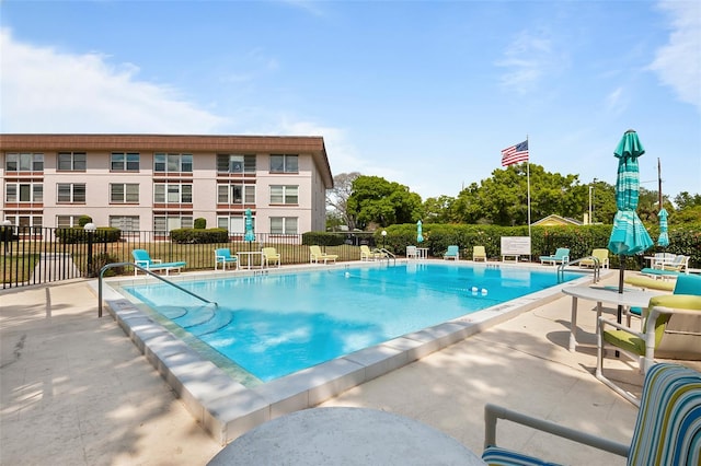 view of swimming pool with a patio