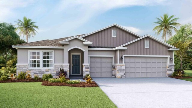 view of front of home with a garage and a front lawn