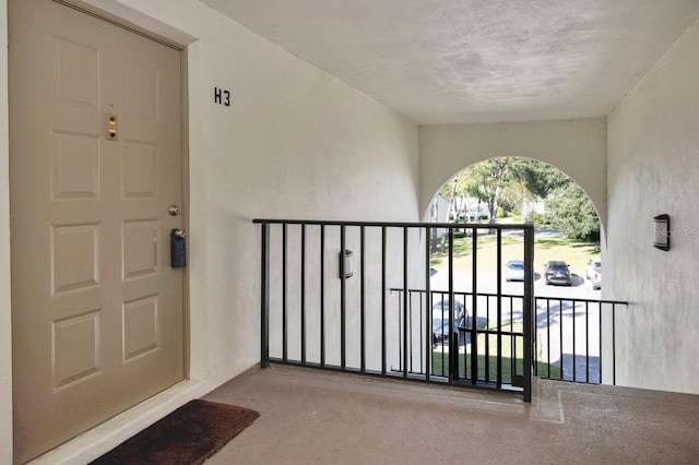 entrance to property with a balcony