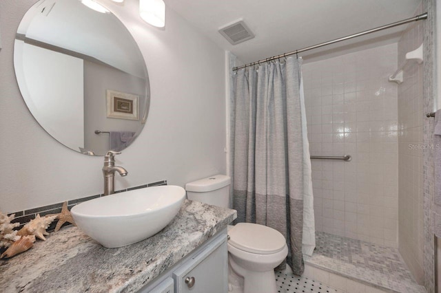 bathroom with vanity, toilet, and a shower with curtain