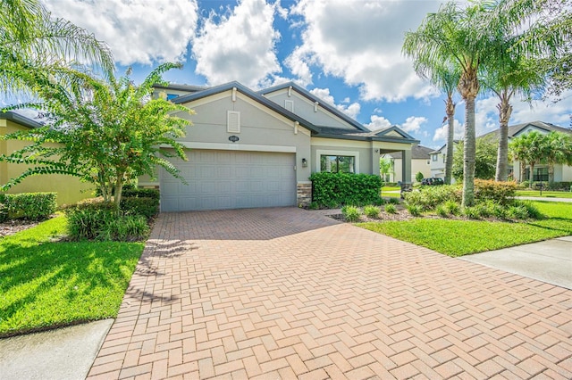 view of front of home featuring a front yard and a garage