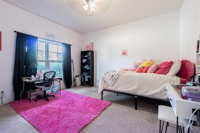 bedroom featuring ceiling fan and light carpet